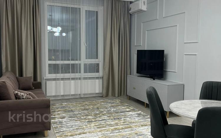 2-комнатная квартира · 55 м² · 9/14 этаж, Кабанбай Батыра 56 за 350 000 ₸ в Астане, Есильский р-н — фото 2