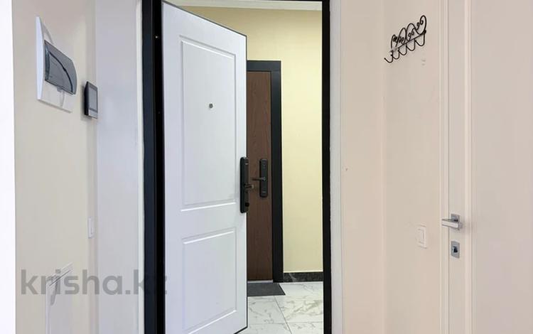 2-комнатная квартира · 54 м² · 9/10 этаж, Б. Момышулы 5 за 32 млн 〒 в Алматы, Алатауский р-н — фото 2