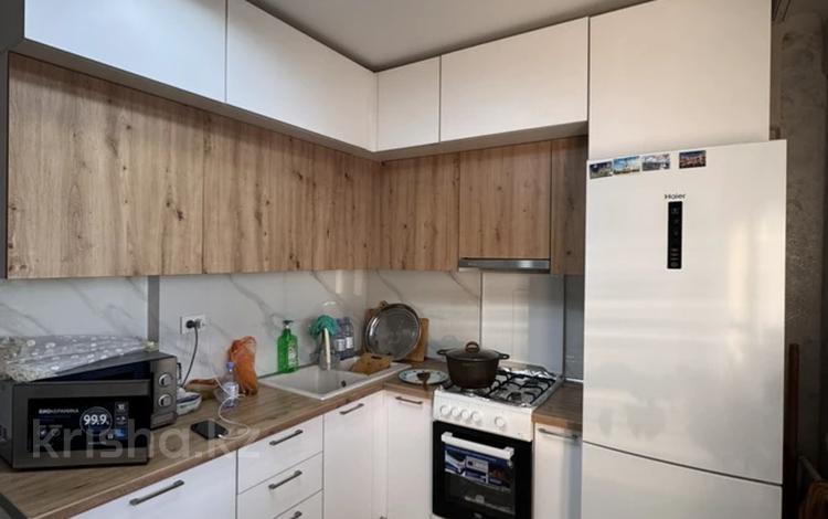 2-комнатная квартира · 50.7 м² · 9/9 этаж, мкр Аксай-3Б за 35 млн ₸ в Алматы, Ауэзовский р-н — фото 2