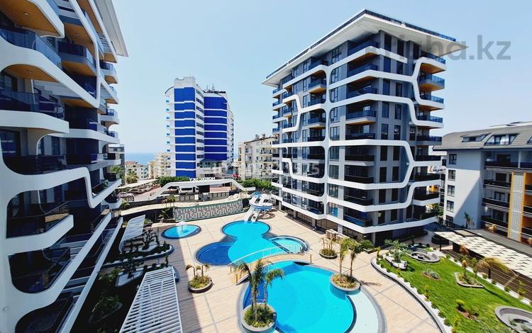 2-комнатная квартира · 59.5 м² · 4/9 этаж, Tosmur — Район Тосмур за 121 млн 〒 в Аланье — фото 2