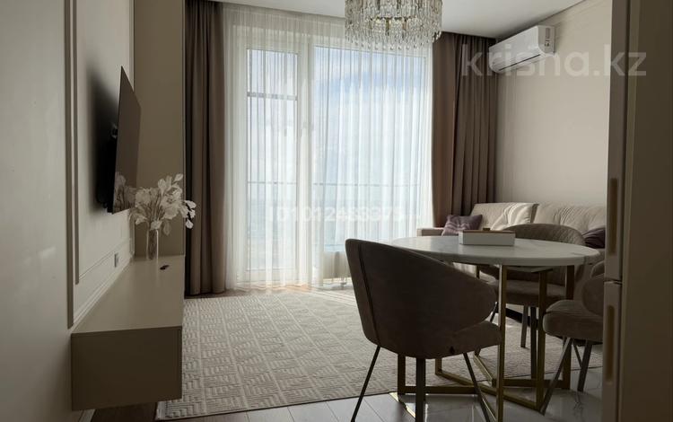 2-комнатная квартира · 54 м² · 14/16 этаж, К. Толеметова 64/1 за 42 млн ₸ в Шымкенте, Абайский р-н — фото 2
