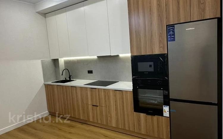 2-комнатная квартира · 56.1 м² · 12/20 этаж, Тургут Озала 237 за 53.5 млн ₸ в Алматы, Бостандыкский р-н — фото 2