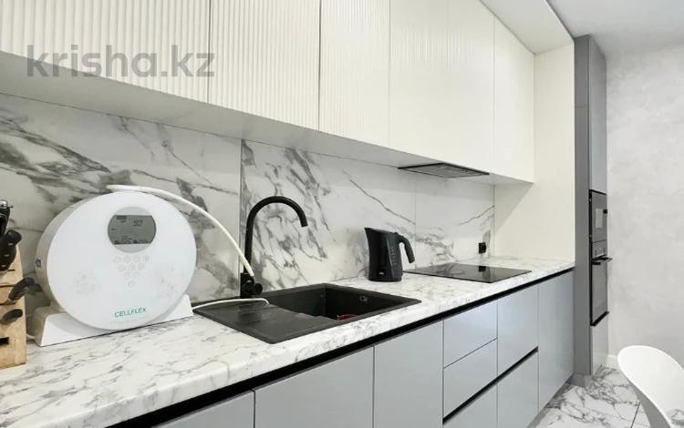 2-комнатная квартира · 70 м² · 5/12 этаж, Тургут Озала 194 за 73 млн ₸ в Алматы, Алмалинский р-н — фото 2