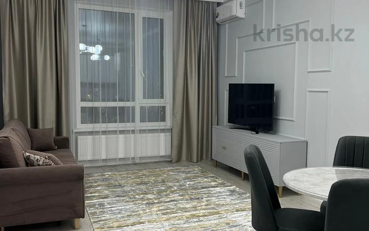 2-комнатная квартира · 55 м² · 9/14 этаж, Кабанбай батыра 56б за 350 000 ₸ в Астане, Есильский р-н — фото 2